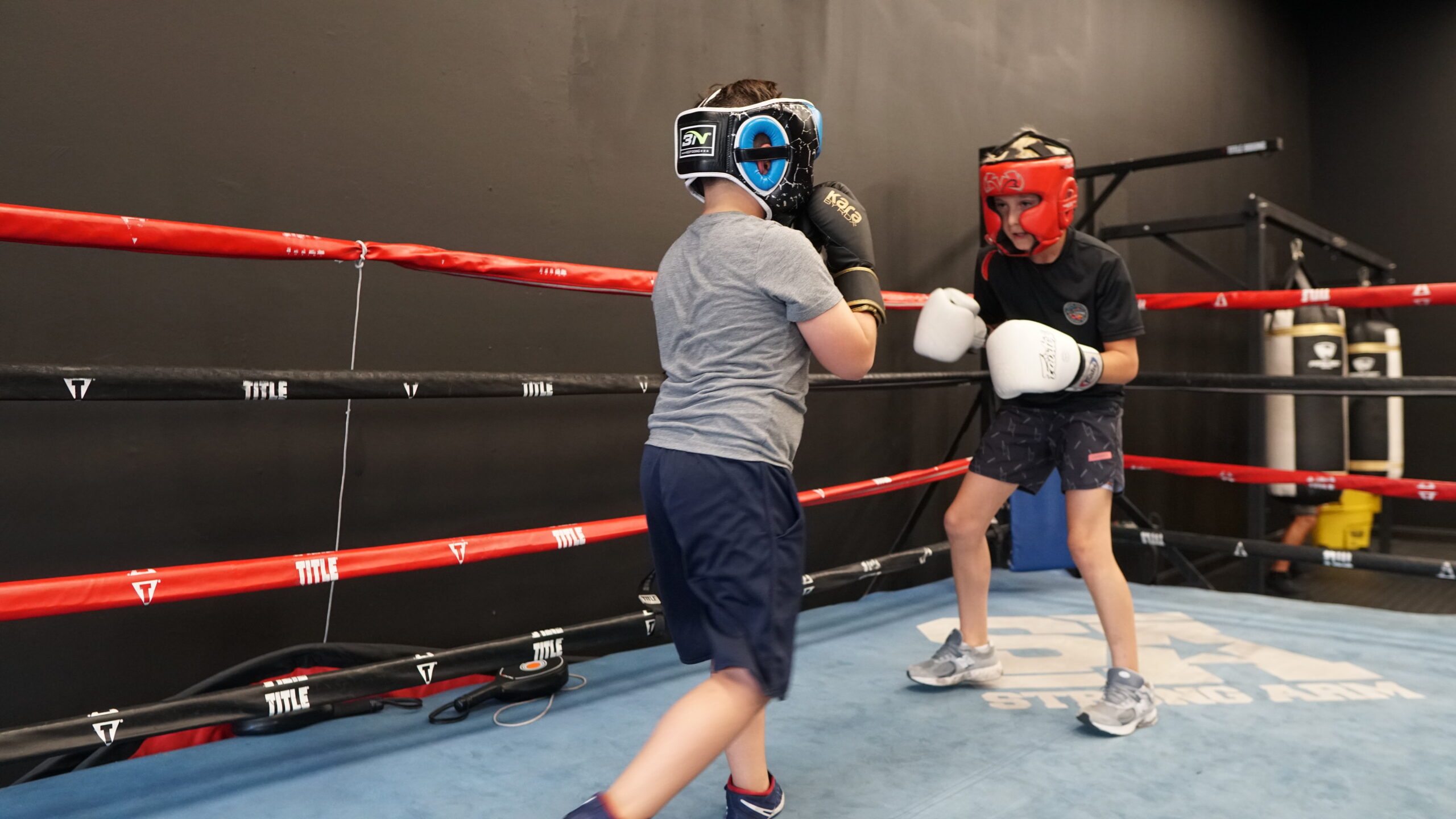 Two kids sharing the ring at KM Boxing gym in West Palm Beach Florida